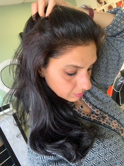 Phool patti henna paste results in red highlights.